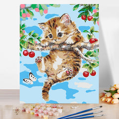 Cat hanging on a tree